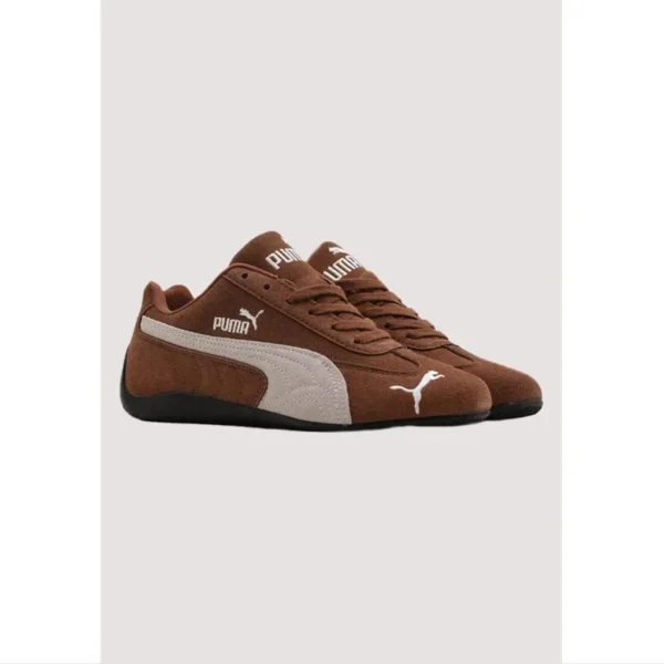 Brown Puma shoes with accessories included